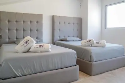 Cama o camas de una habitación en New Beachfront Paradise at Armandos Le Club