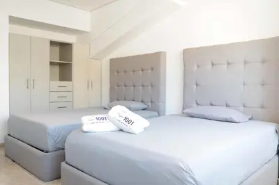 Cama o camas de una habitación en New Beachfront Paradise at Armandos Le Club