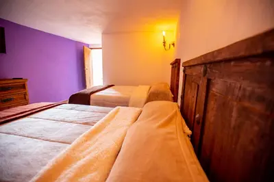 Cama o camas de una habitación en Hotel Estancia 1928