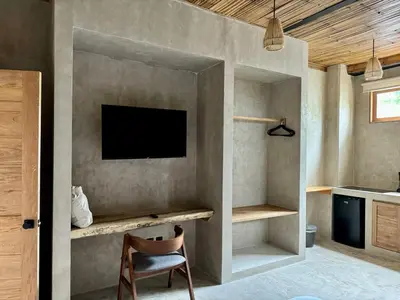 Una televisión o centro de entretenimiento en Casa Badú