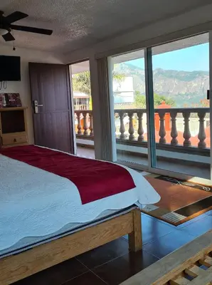 Cama o camas de una habitación en Hotel Leyenda del Tepozteco