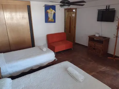 Cama o camas de una habitación en Hotel Leyenda del Tepozteco