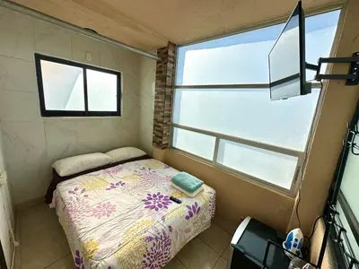 Cama o camas de una habitación en Alojamientos Xolotl