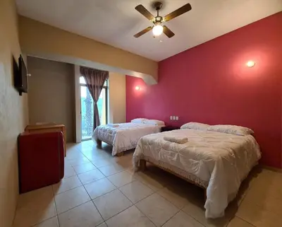 Cama o camas de una habitación en Hotel Arcadia Cuernavaca
