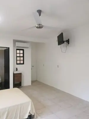 Una televisión o centro de entretenimiento en Casa Gemelas