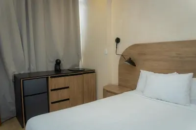 Cama o camas de una habitación en Hotel & hostal Morada