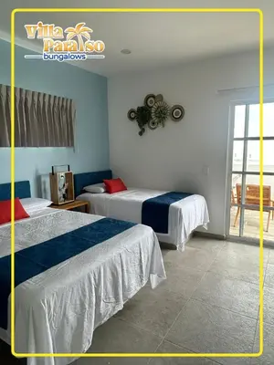 Cama o camas de una habitación en Bungalows Villa Paraíso