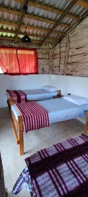 Cama o camas de una habitación en Cabañas Tres Soles
