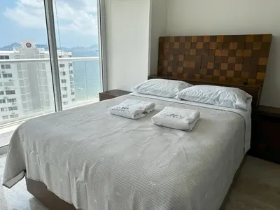 Cama o camas de una habitación en Departamento Moderno con Vista al Mar