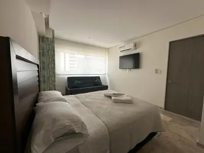 Cama o camas de una habitación en Departamento Moderno con Vista al Mar