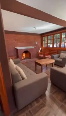 Zona de estar de Cabaña la Escondida