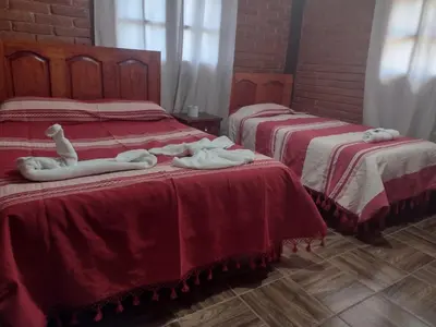 Cama o camas de una habitación en Cabaña la Escondida
