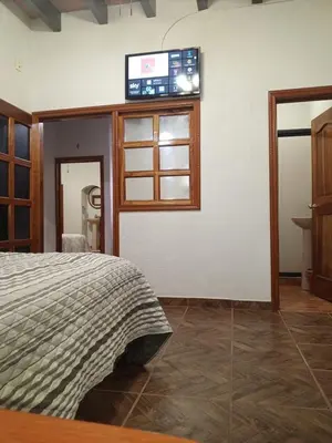 Una televisión o centro de entretenimiento en Posada Valle Sagrado