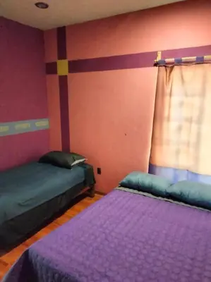 Cama o camas de una habitación en Casa de las iguanas
