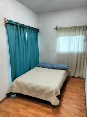 Cama o camas de una habitación en Casa de las iguanas