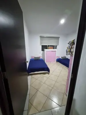 Cama o camas de una habitación en La ideal Alberca climatizada