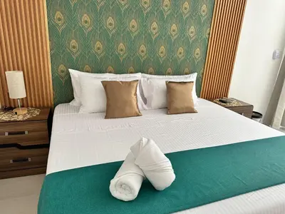 Cama o camas de una habitación en Hotel Punta Colibrí