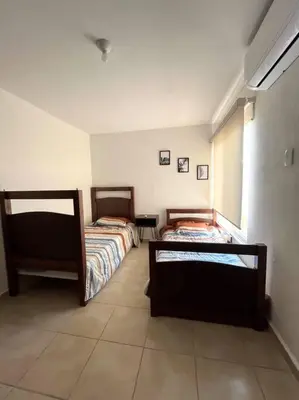 Cama o camas de una habitación en Villa Sol Terrasol Acapulco Diamante