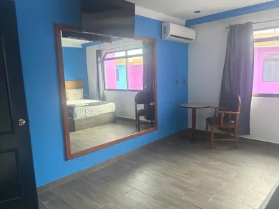 Cama o camas de una habitación en Auto Hotel El Cine