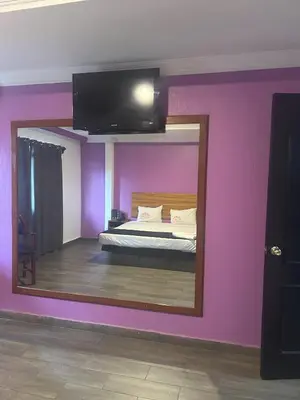 Cama o camas de una habitación en Auto Hotel El Cine