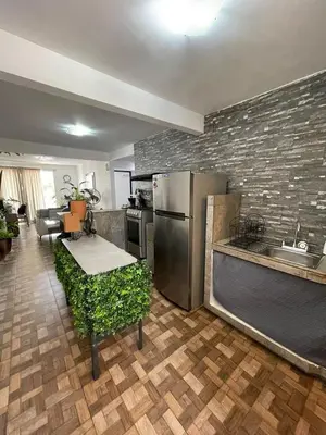 Una cocina o zona de cocina en Cómodo Depto frente a plaza Américas Xalapa Ver