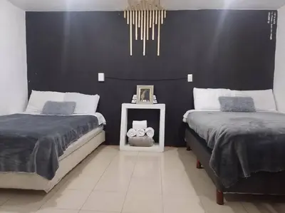 Cama o camas de una habitación en Hermoso Loft a 15min AICM