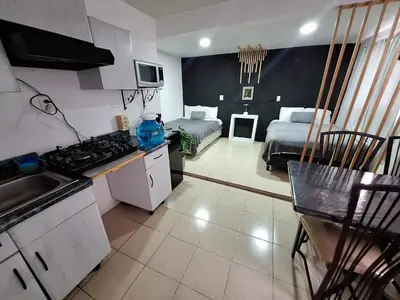 Una cocina o zona de cocina en Hermoso Loft a 15min AICM