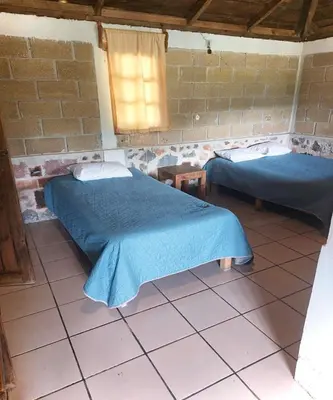 Cama o camas de una habitación en OYO Hotel Rincon De Texolo