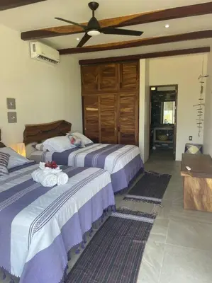 Cama o camas de una habitación en Villa De Las Rocas