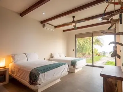 Cama o camas de una habitación en Villa De Las Rocas