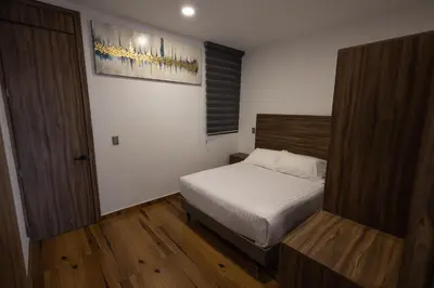 Cama o camas de una habitación en Departamentos Amaneceres Zacatlán