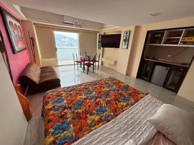 Cama o camas de una habitación en Apartamento con vista al mar