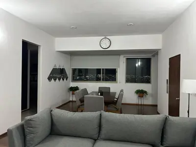 Zona de estar de Blue Towers Piso 9 - Departamento Moderno en Puebla