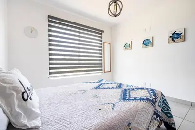 Cama o camas de una habitación en Hermoso Departamento con club de playa en diamante