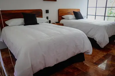 Cama o camas de una habitación en Hotel Casa María