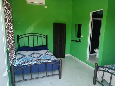 Cama o camas de una habitación en Tu Refugio en chachalacas