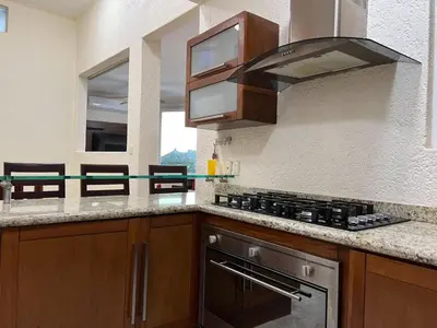 Una cocina o zona de cocina en 3 Atardeceres, Pet Friendly Vista al Mar en Brisas