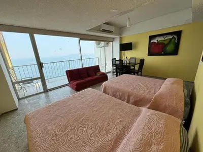 Cama o camas de una habitación en Playa dorada 1
