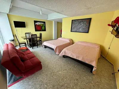 Cama o camas de una habitación en Playa dorada 1