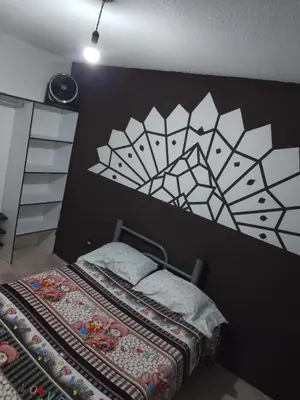Cama o camas de una habitación en Renta de Habitaciones en muy buena ubicación