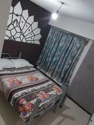 Cama o camas de una habitación en Renta de Habitaciones en muy buena ubicación