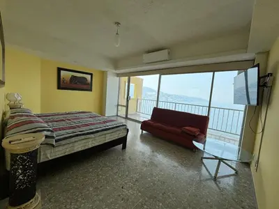 Cama o camas de una habitación en Playa dorada