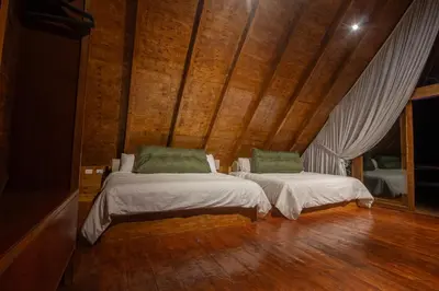 Cama o camas de una habitación en Riverside Hotel Chachalacas