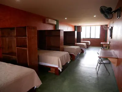 Cama o camas de una habitación en Madre Tierra Hostal