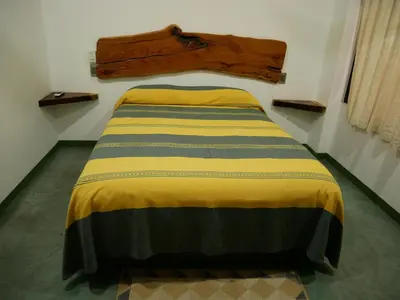 Cama o camas de una habitación en Madre Tierra Hostal