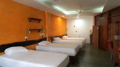 Cama o camas de una habitación en Madre Tierra Hostal