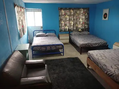 Cama o camas de una habitación en Cómodo alojamiento para varias personas