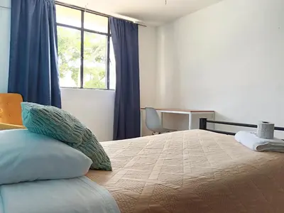 Cama o camas de una habitación en Habitación individual con baño cerca al Parque San José