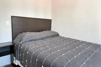 Cama o camas de una habitación en Habitación acogedora
