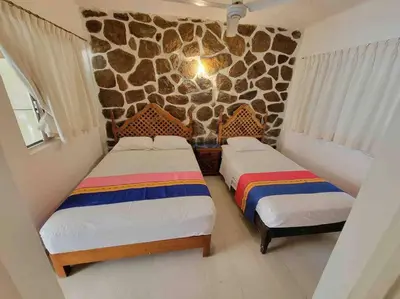 Cama o camas de una habitación en Tranquilo y cómodo Bungalow